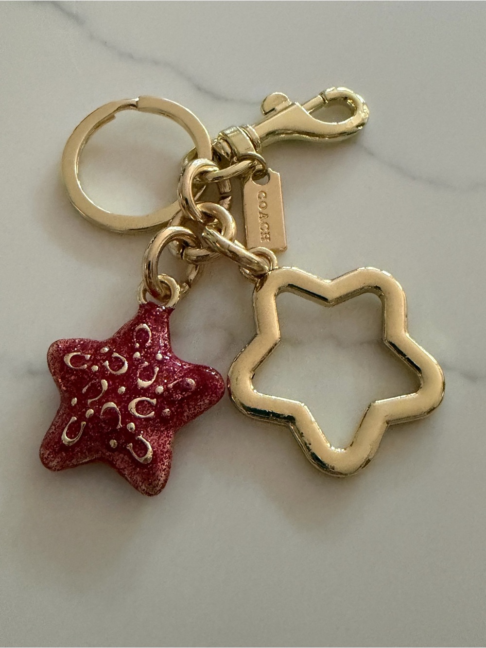 COACH Gold-Tone Star Charm Key Ring with Pink Glitter Star
